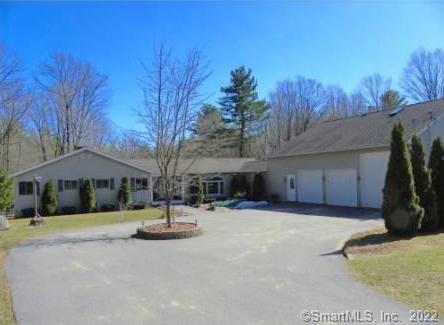 46 Millbrook Road Colebrook, CT 06021 - Photo 1 of 1 a view of a house with backyard and trees