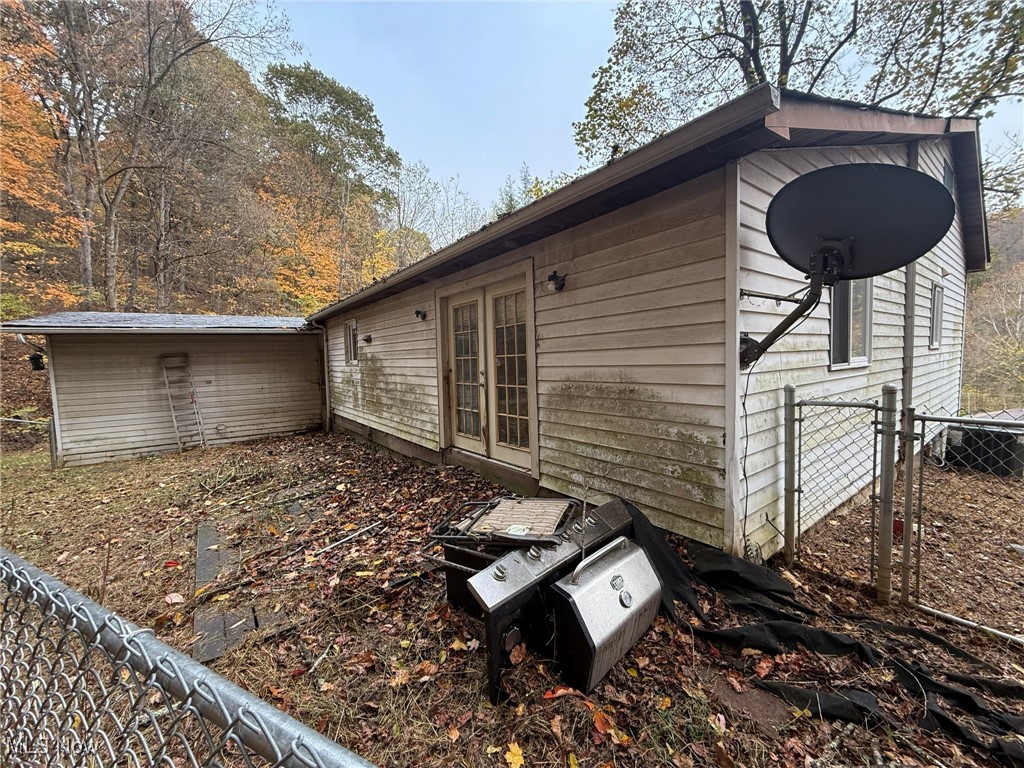 4589 Harmon Creek Road Colliers, WV 26035 - Photo 6 of 26 View of property exterior with a gate