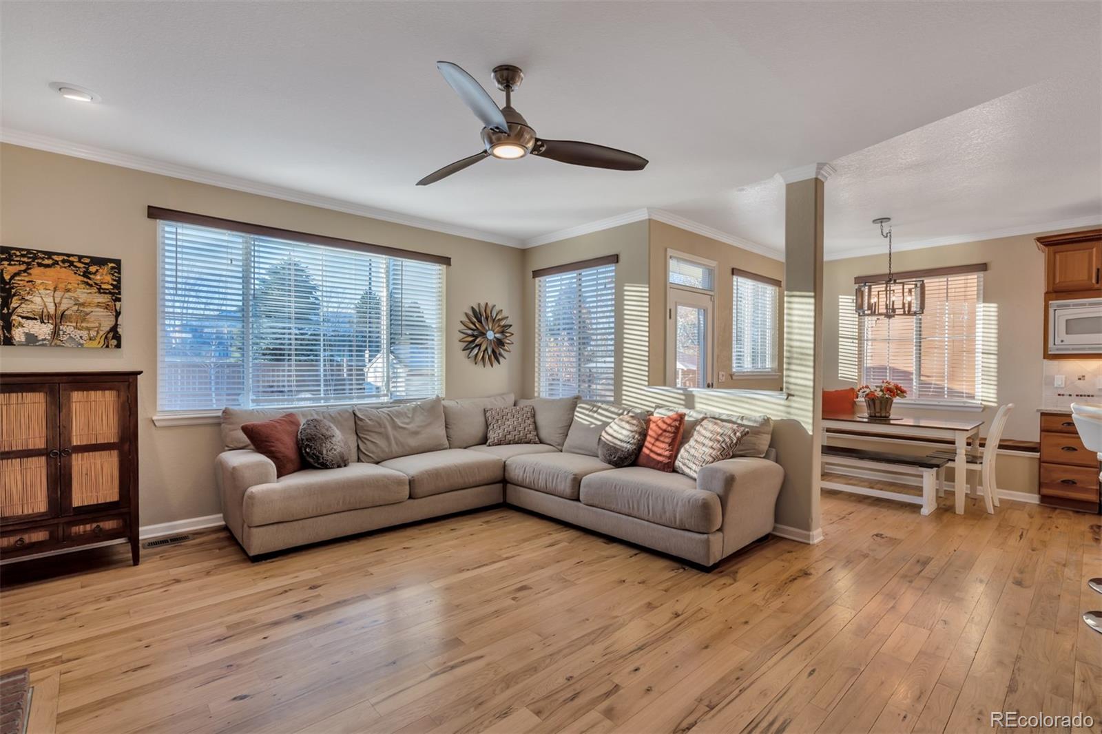 10735 Wynspire Road Highlands Ranch, CO 80130 - Photo 11 of 40 a living room with furniture and a large window