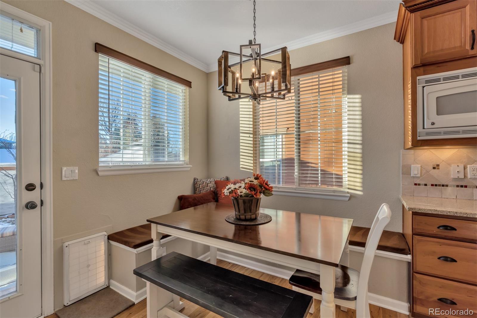 10735 Wynspire Road Highlands Ranch, CO 80130 - Photo 12 of 40 a dining room with furniture and window