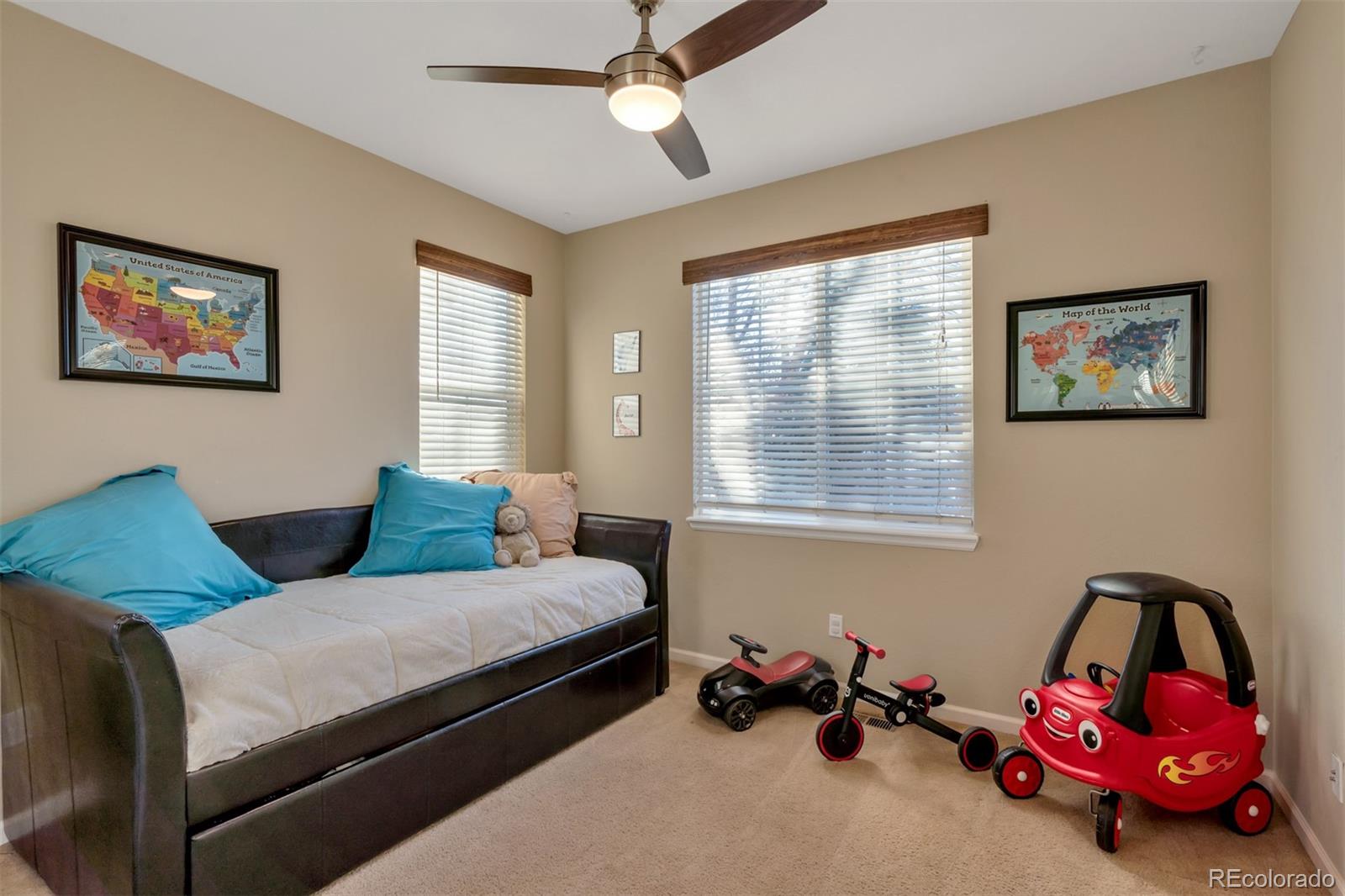 10735 Wynspire Road Highlands Ranch, CO 80130 - Photo 13 of 40 a bedroom with bed and a window