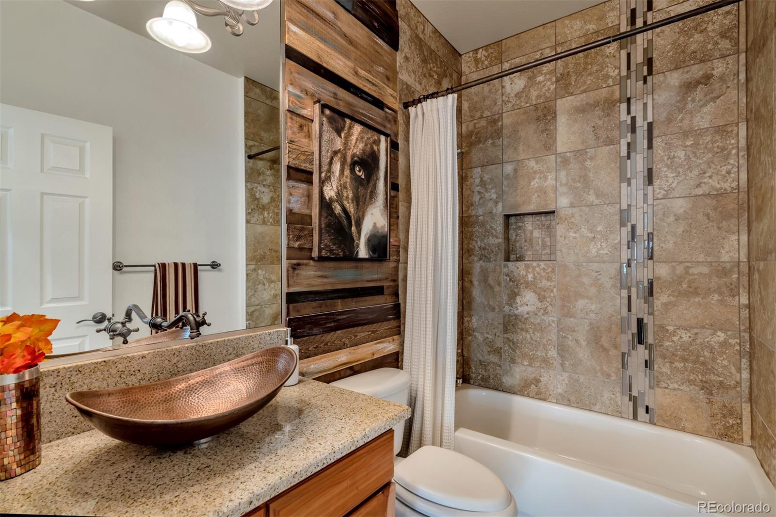 10735 Wynspire Road Highlands Ranch, CO 80130 - Photo 14 of 40 a bathroom with a sink and a mirror