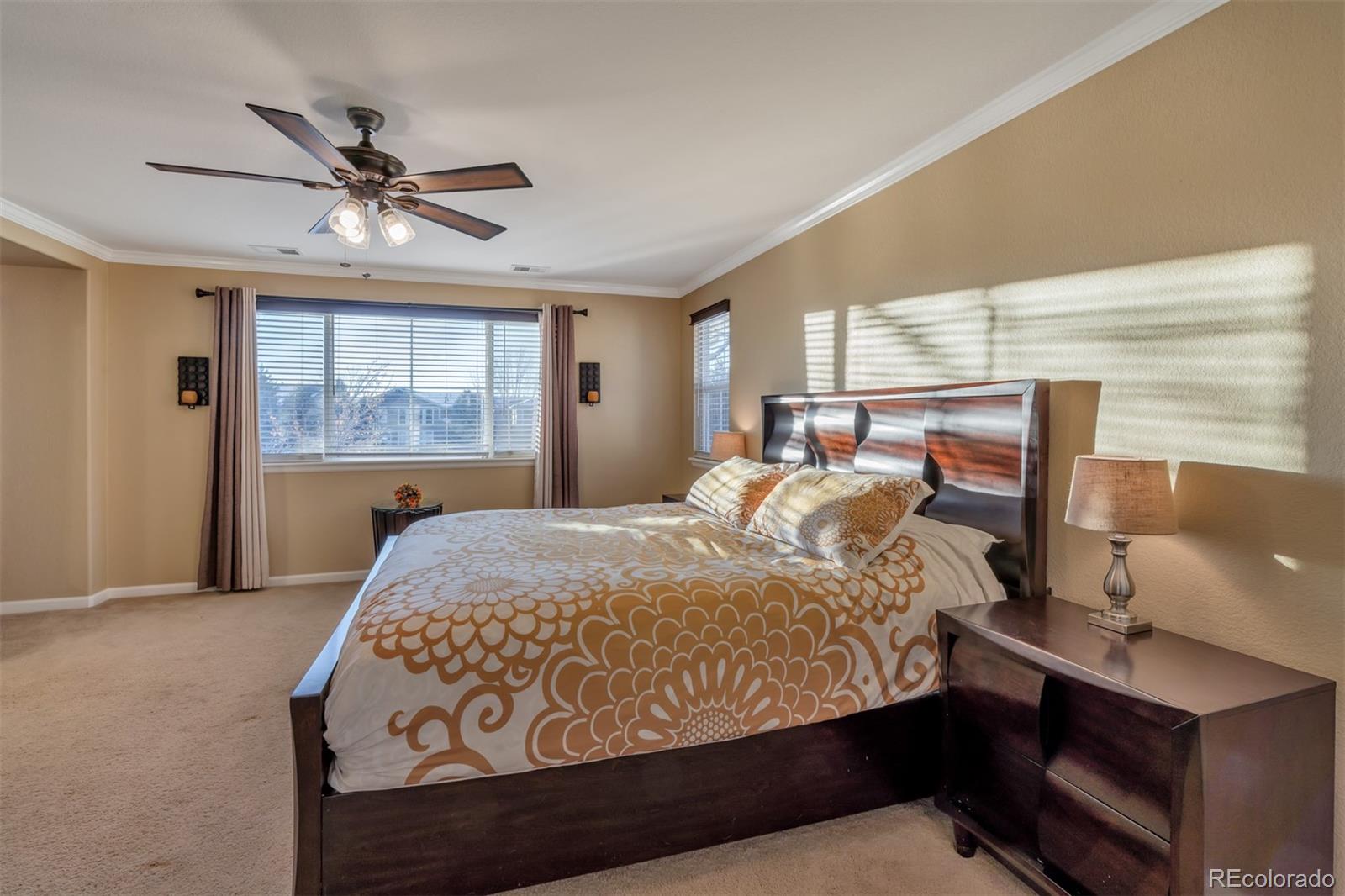 10735 Wynspire Road Highlands Ranch, CO 80130 - Photo 24 of 40 a bedroom with a bed and window