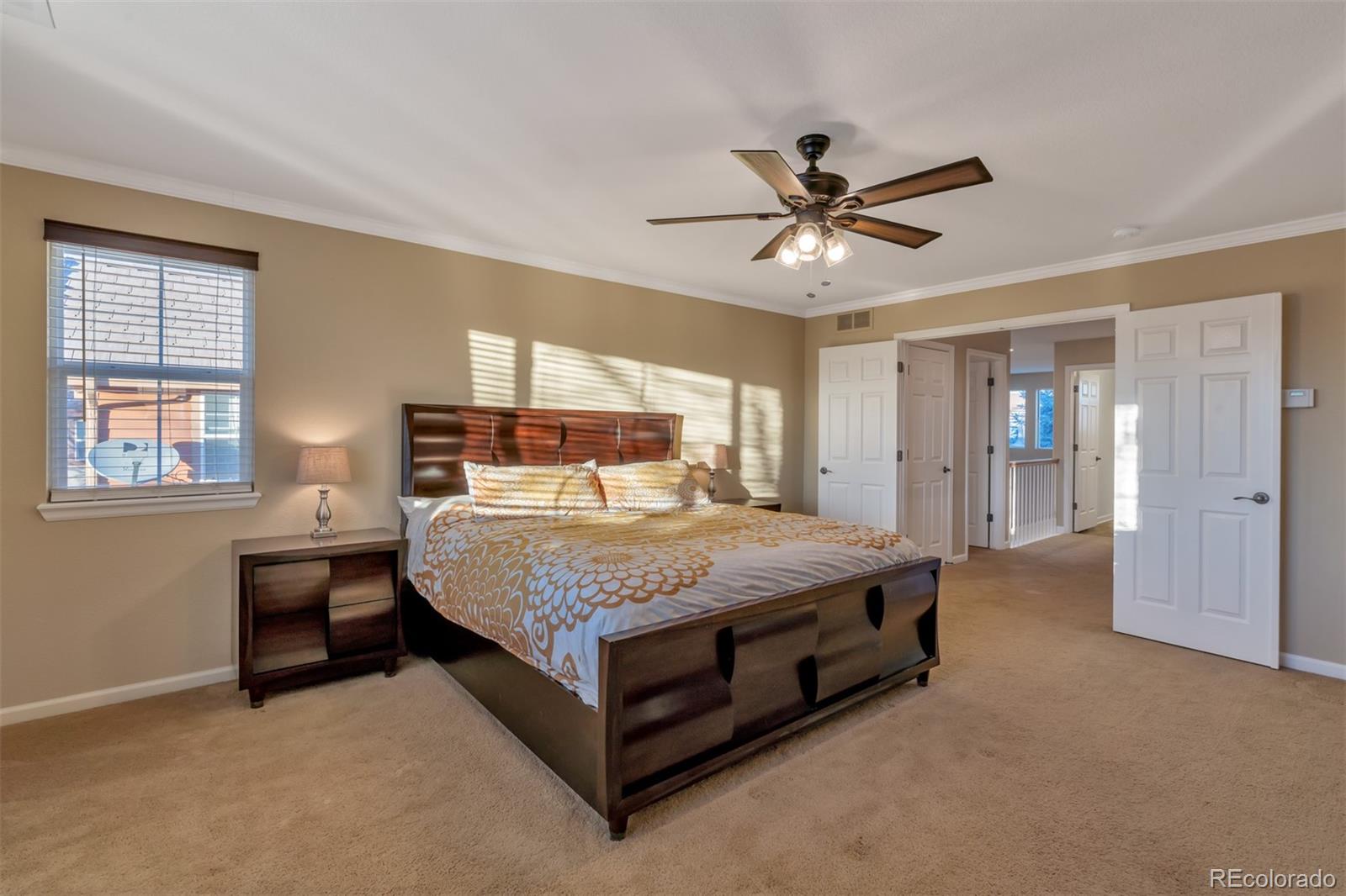10735 Wynspire Road Highlands Ranch, CO 80130 - Photo 25 of 40 a bedroom with a bed and window