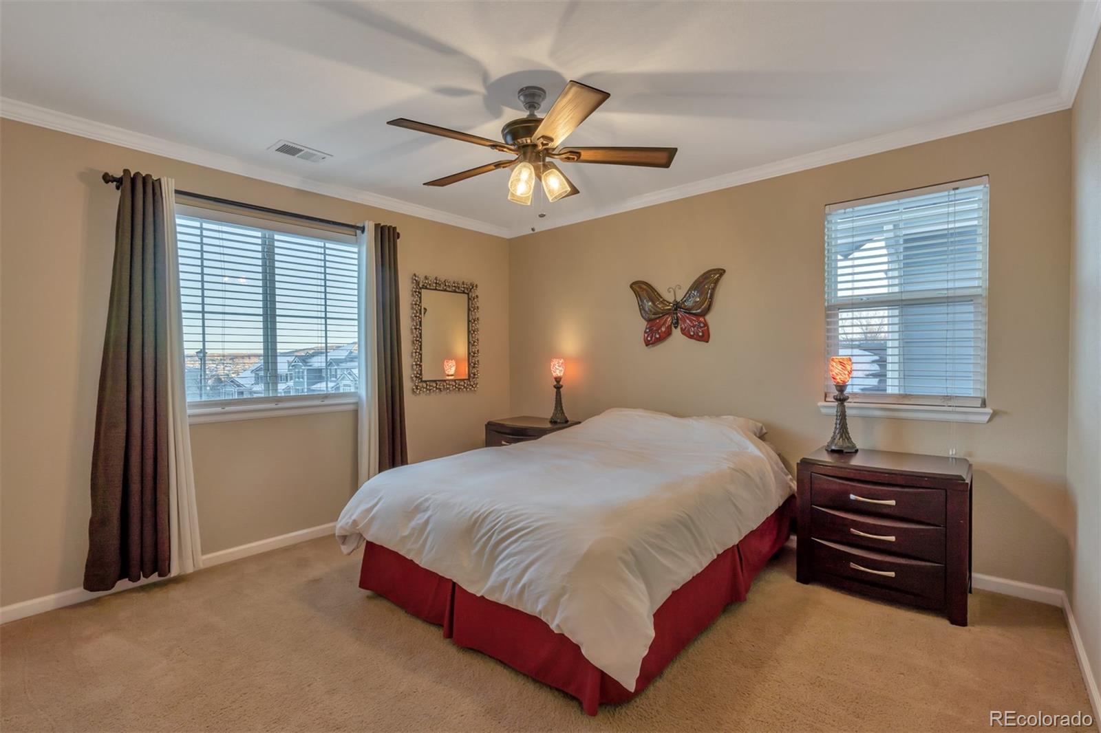 10735 Wynspire Road Highlands Ranch, CO 80130 - Photo 34 of 40 a bedroom with a bed and window