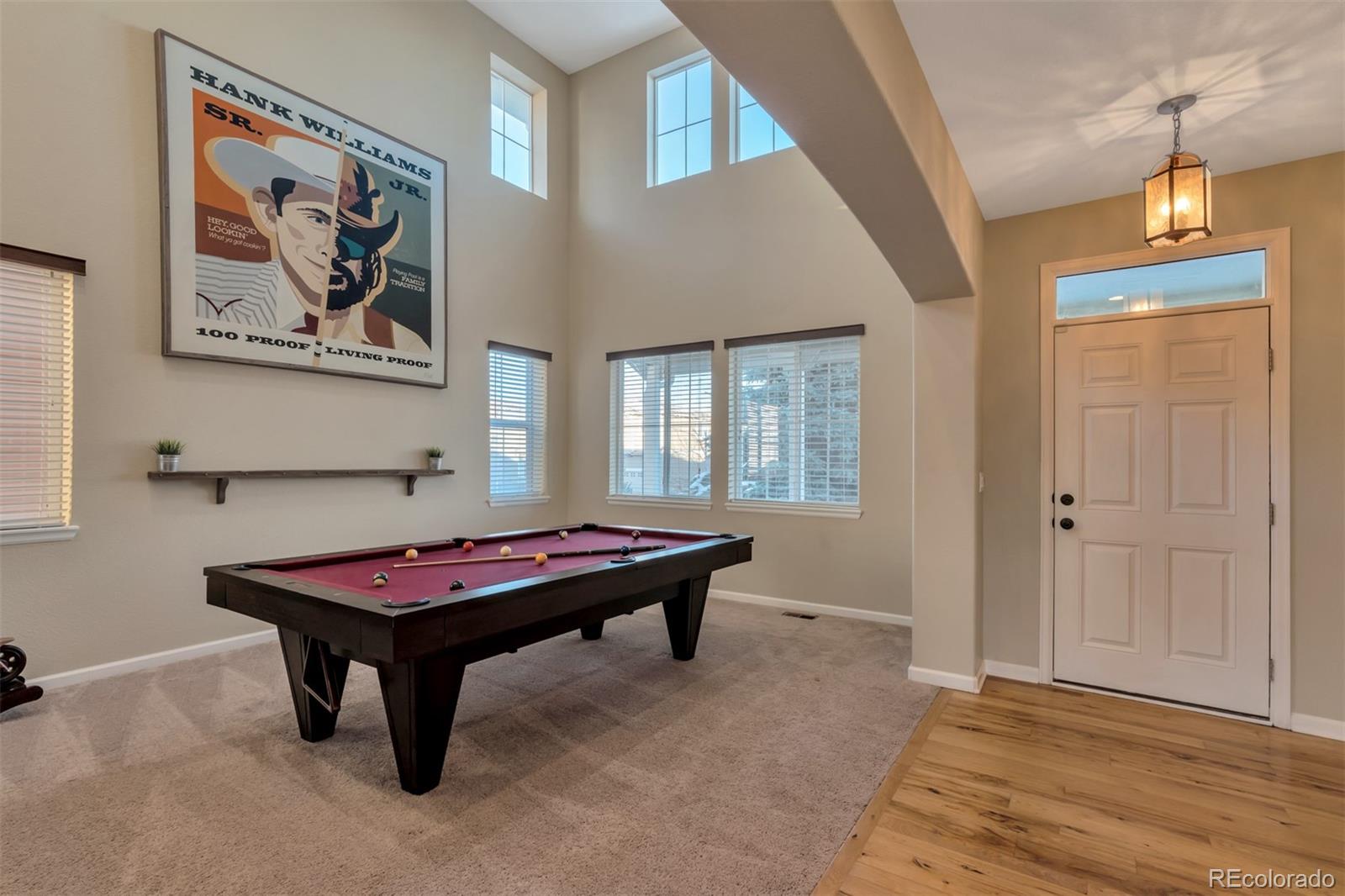 10735 Wynspire Road Highlands Ranch, CO 80130 - Photo 6 of 40 a room with pool table and windows