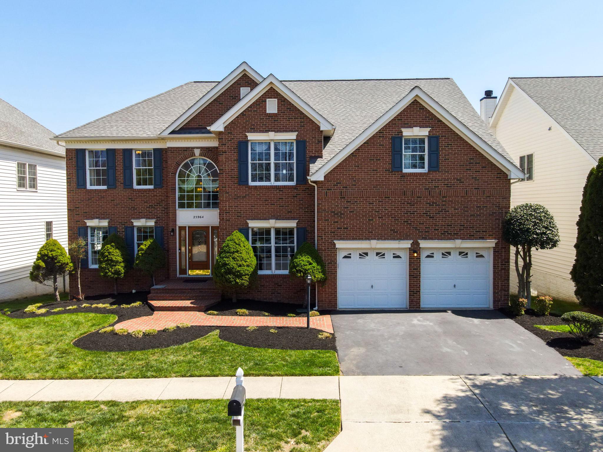 25964 Donovan Drive Chantilly, VA 20152 - Photo 1 of 1 a front view of a house with a yard and garage
