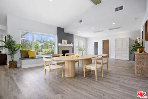 a bathroom with a granite countertop sink double and mirror