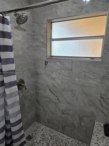 a bedroom with a bed and a chair