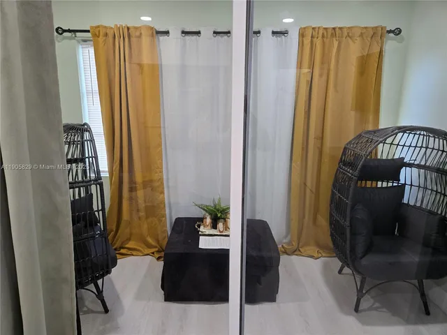 a bedroom with a bed and a chair