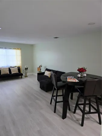 a living room with furniture and a chair