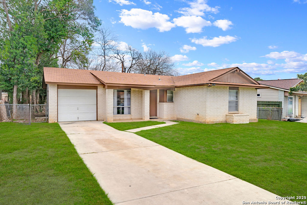 6706 Red Bluff Road San Antonio, TX 78218 - Photo 3 of 17 a view of a yard in front of a house with green space