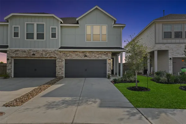a front view of a house with yard