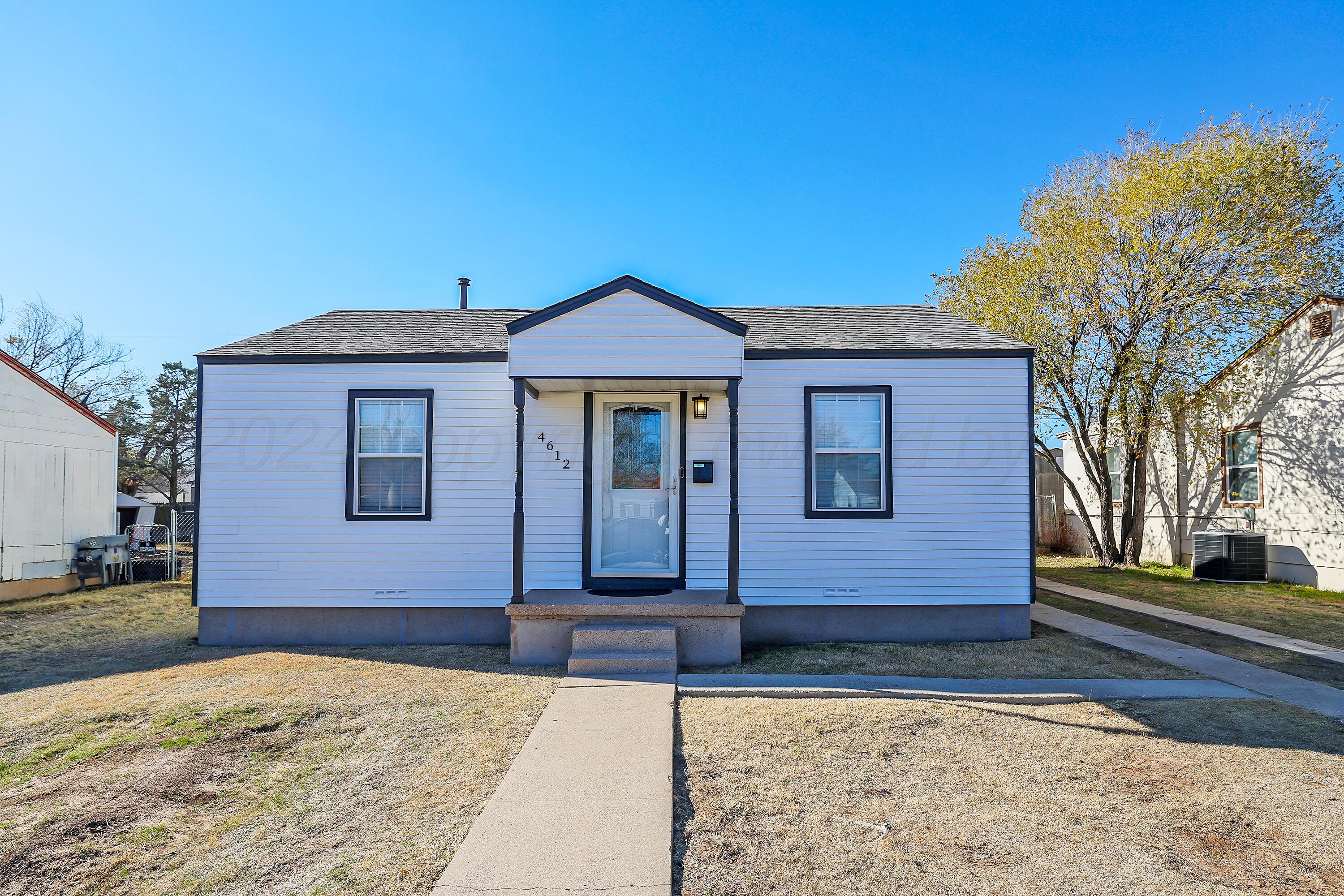 4612 South Parker Street Amarillo, TX 79110 - Photo 1 of 24 a front view of a house with a yard
