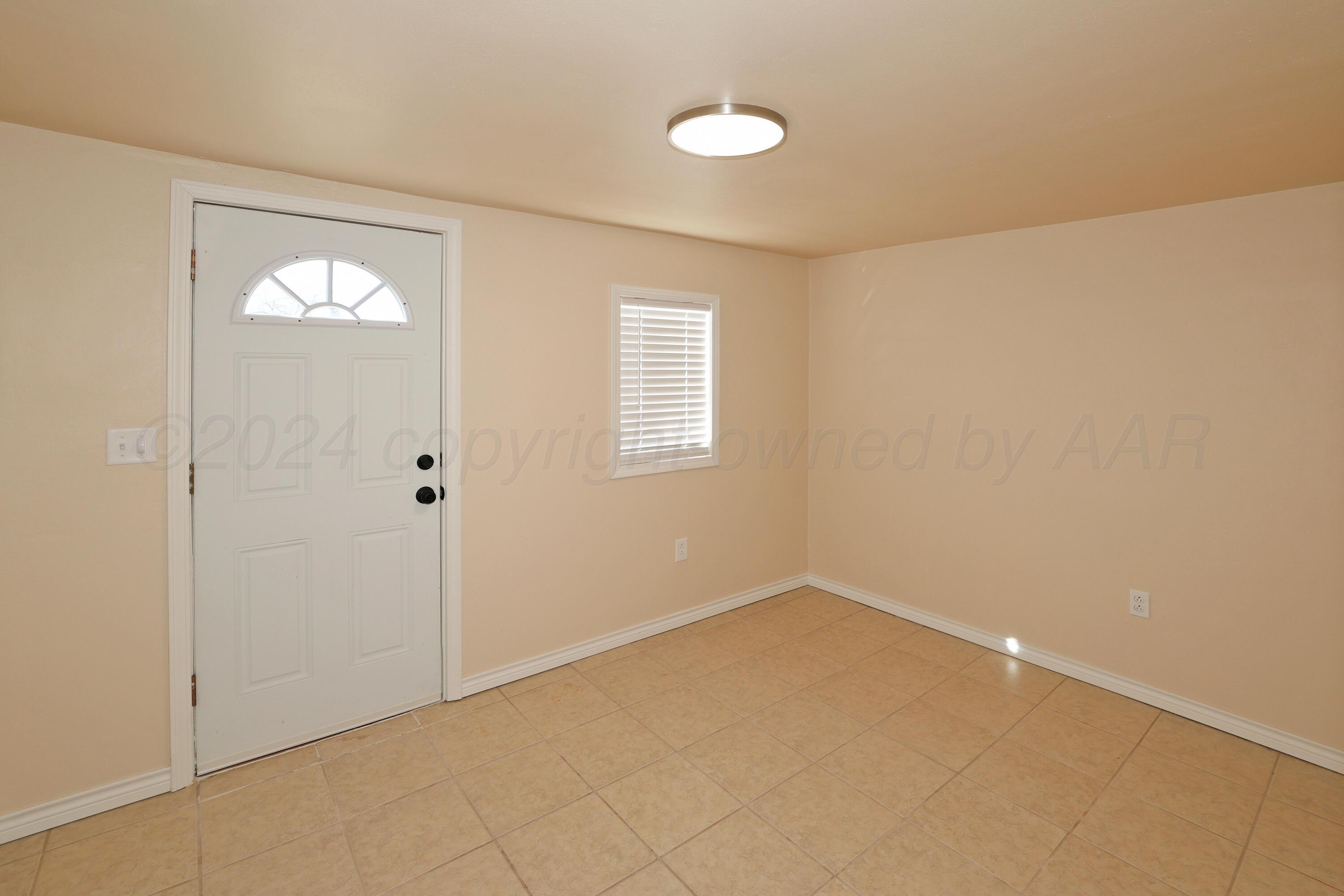 4612 South Parker Street Amarillo, TX 79110 - Photo 17 of 24 an empty room with windows and closet