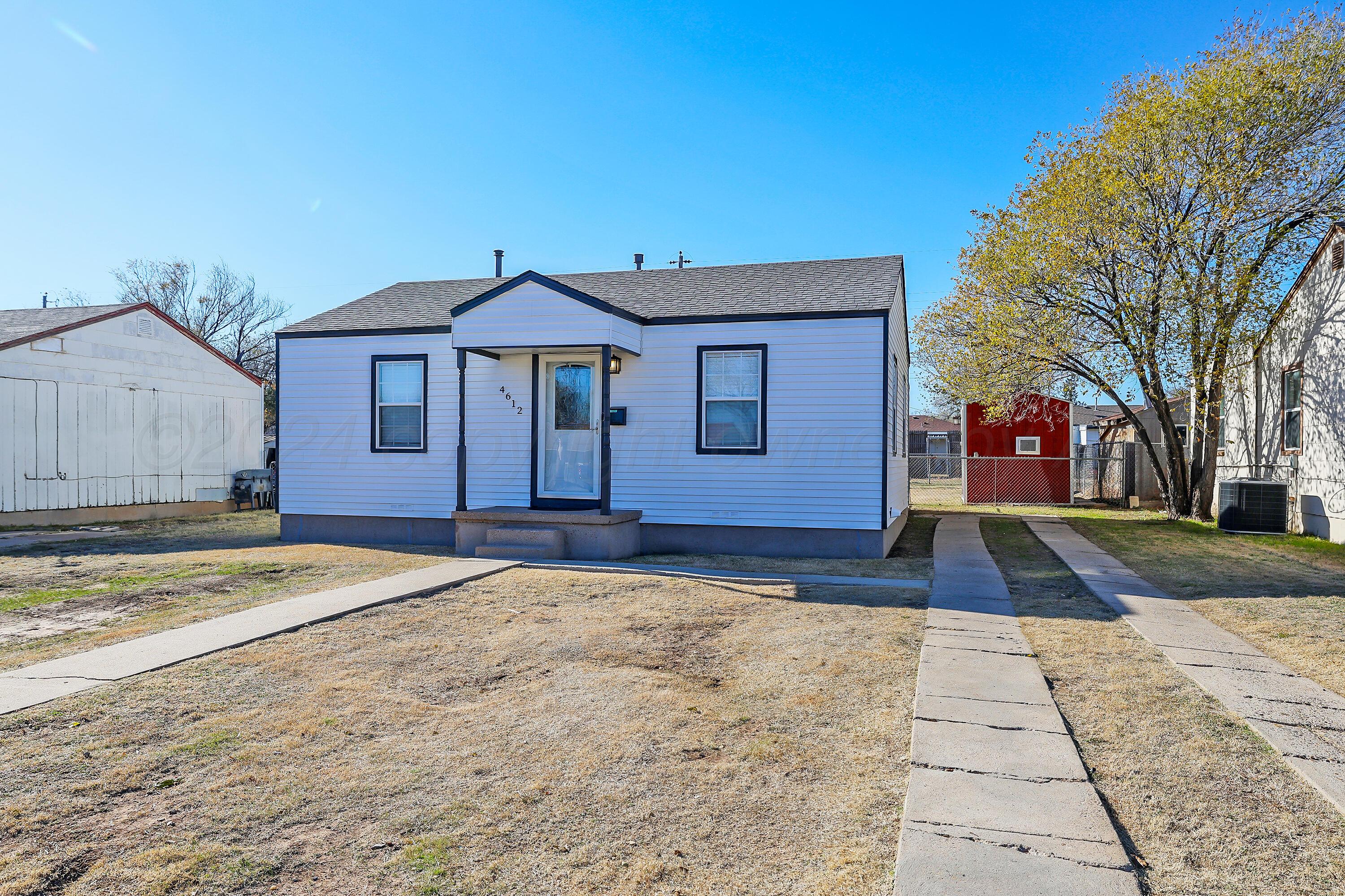 4612 South Parker Street Amarillo, TX 79110 - Photo 2 of 24 a view of a house with a yard