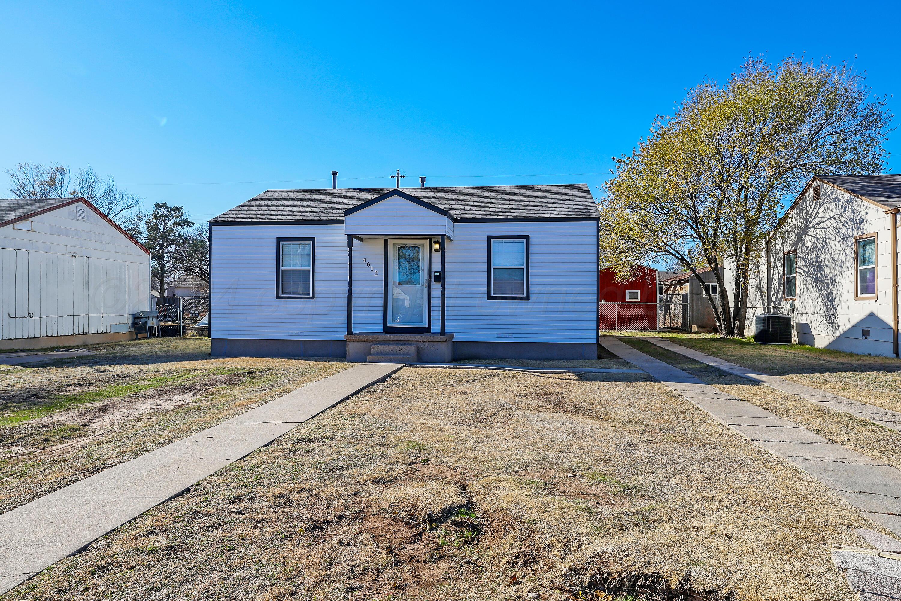 4612 South Parker Street Amarillo, TX 79110 - Photo 3 of 24 a view of a house with a yard