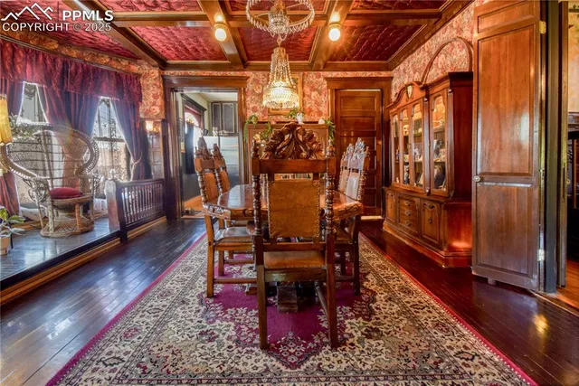 a dining room with furniture and wooden floor