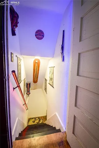 a bathroom with a sink and mirror with bathtub