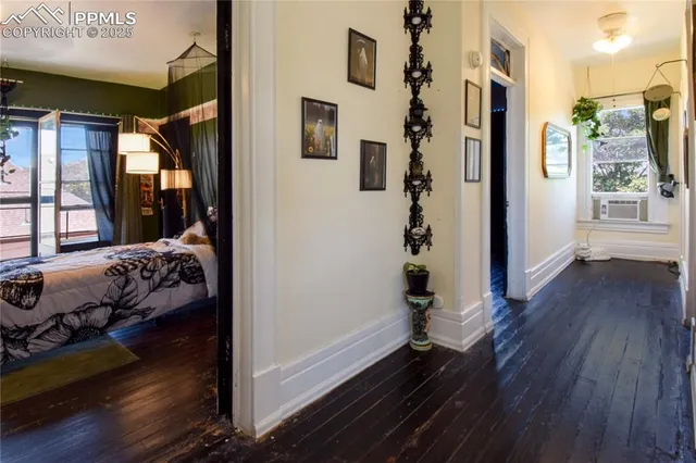 a bedroom with wooden floor