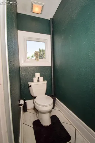 a bathroom with a toilet and a sink