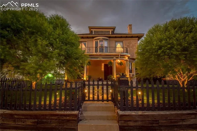 a view of a building with a yard
