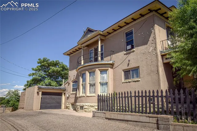 a front view of a house with a garage