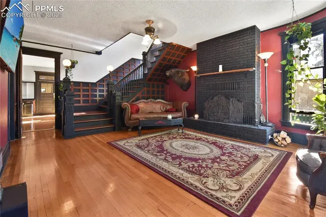 a living room with couch and a rug