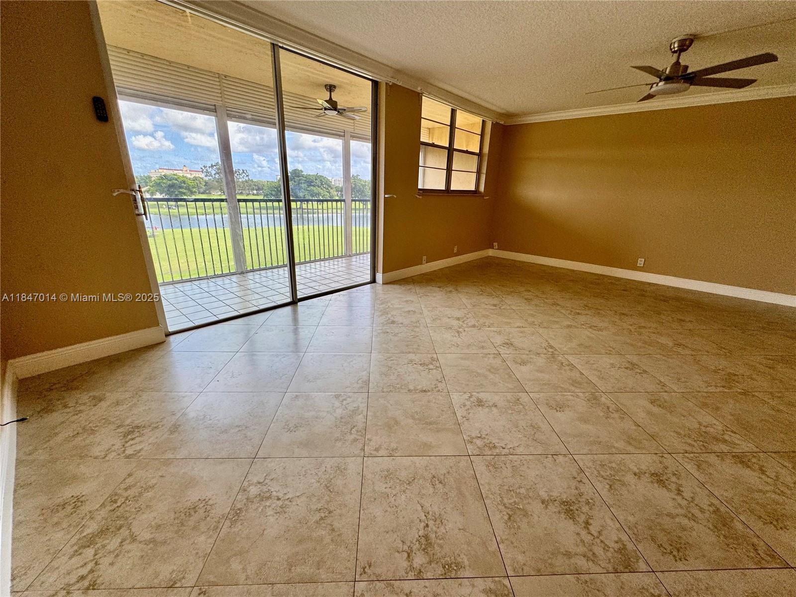 3100 West Rolling Hills Circle, Unit 407 Davie, FL 33328 - Photo 18 of 29 a view of an empty room with a window