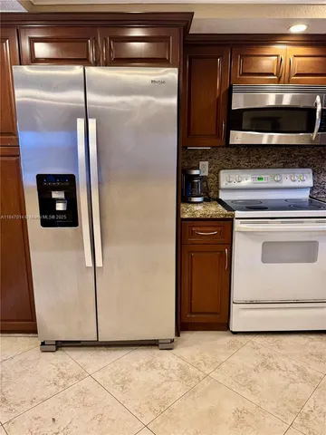 a kitchen with a stove and a microwave