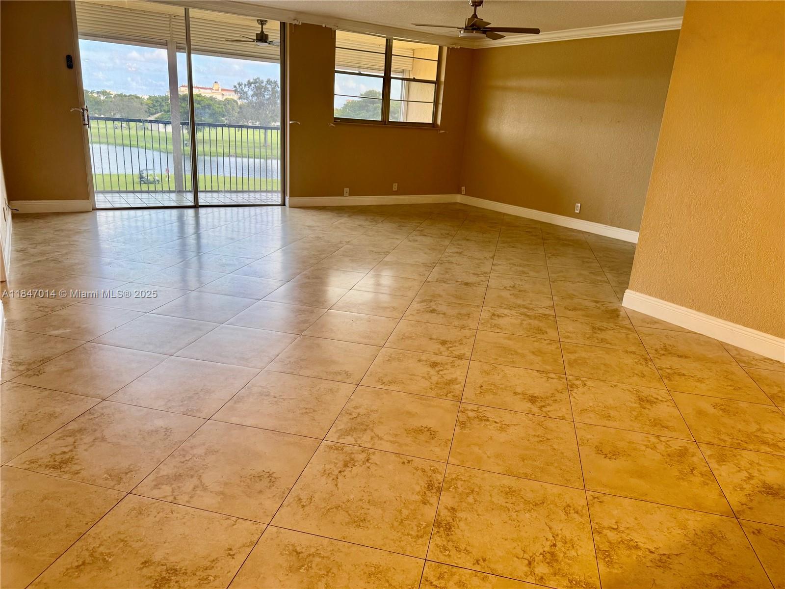3100 West Rolling Hills Circle, Unit 407 Davie, FL 33328 - Photo 6 of 29 a view of an empty room with a window