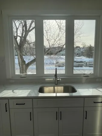 a kitchen with a sink and a window