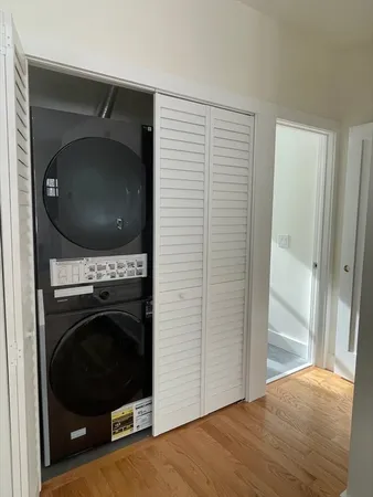 a view of a livingroom with a washer and dryer