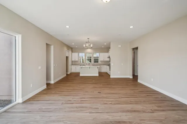 a view of a kitchen with wooden floor