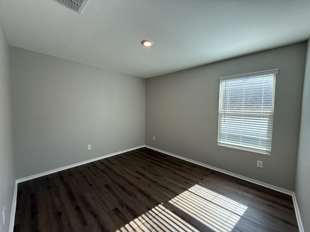 413 Everglades Street Princeton, TX 75407 - Photo 18 of 39 a view of an empty room and a window