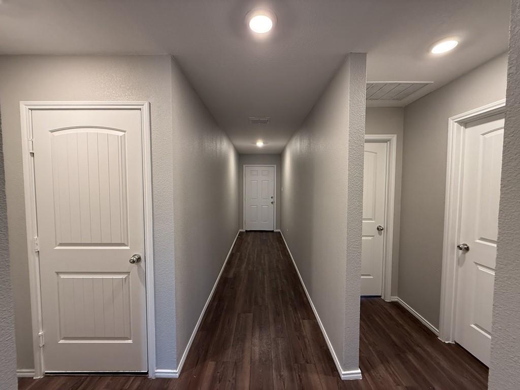 413 Everglades Street Princeton, TX 75407 - Photo 2 of 39 a view of hallway with wooden floor