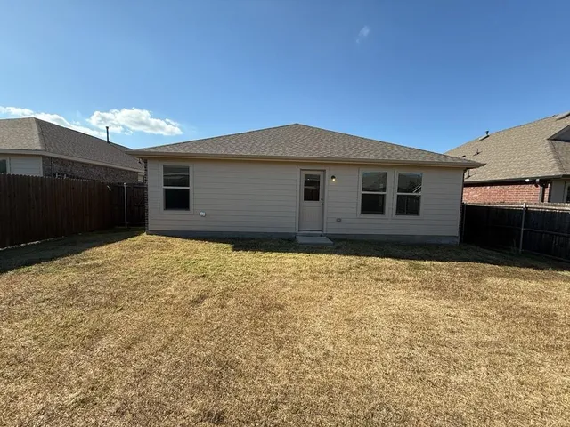 a view of house with yard