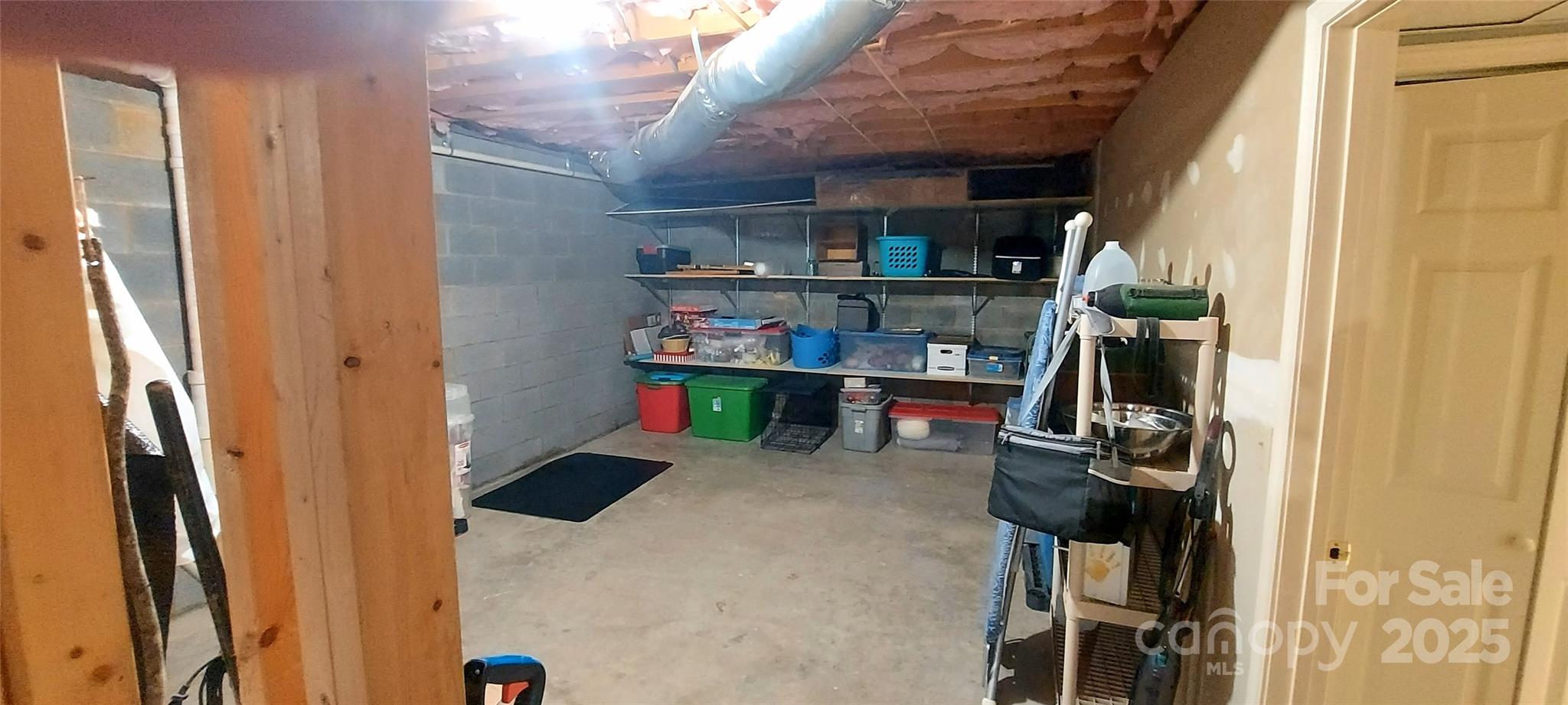 128 Ridgewood Way, Unit 208 Marion, NC 28752 - Photo 13 of 17 a room with storage and utility