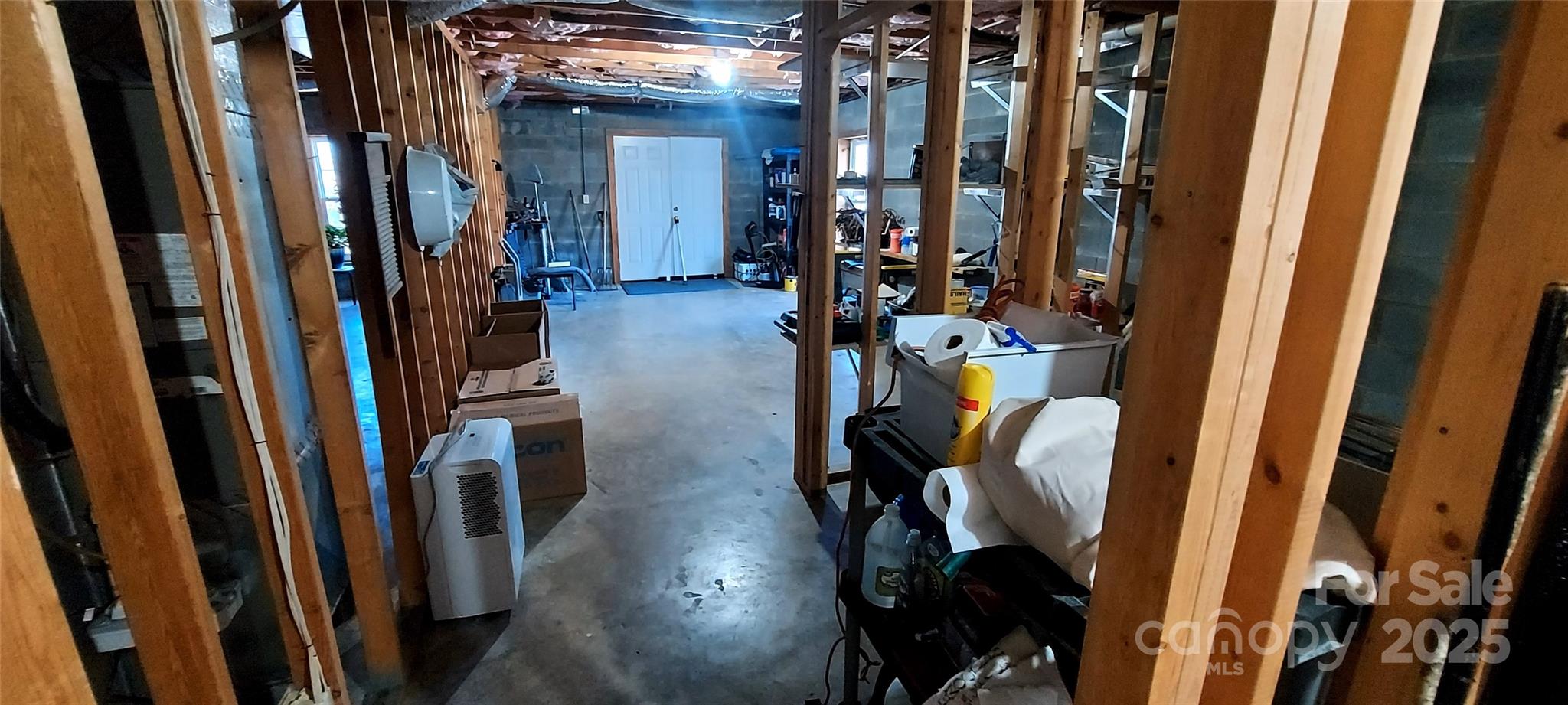 128 Ridgewood Way, Unit 208 Marion, NC 28752 - Photo 14 of 17 a view of walk in closet with clothes and shoes