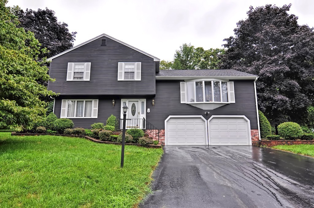 6 Joseph Road Mendon, MA 01756 - Photo 1 of 30 a front view of a house with a yard and garage