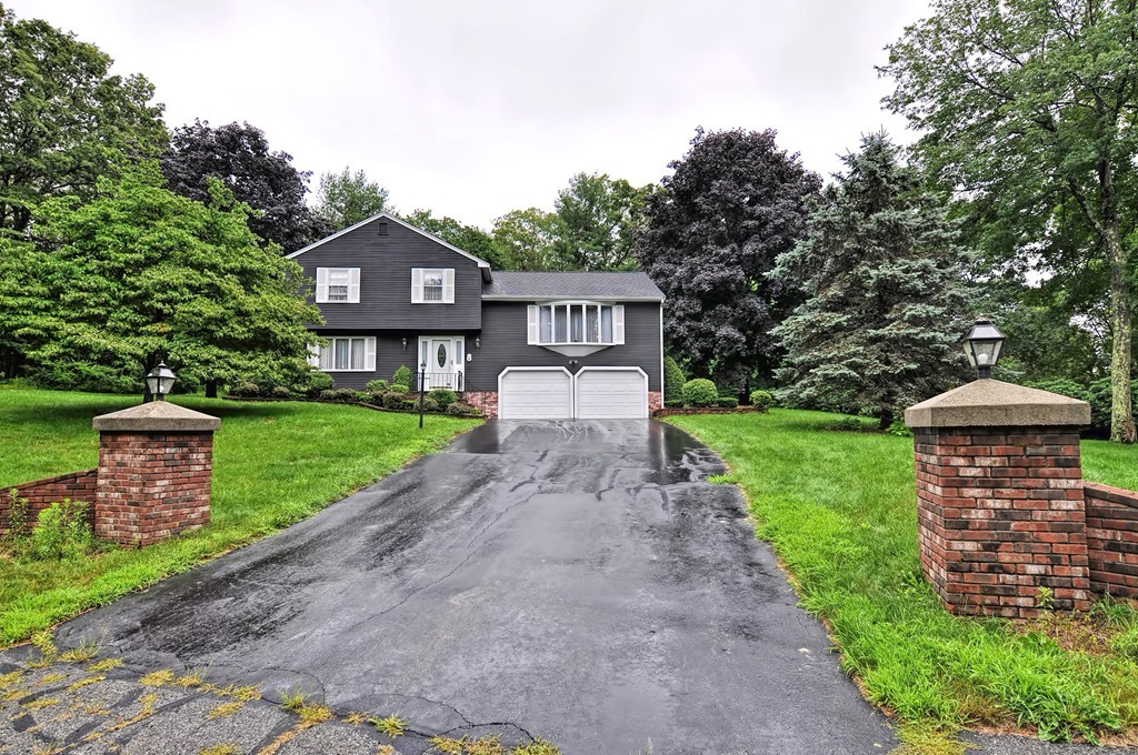 6 Joseph Road Mendon, MA 01756 - Photo 2 of 30 a front view of a house with a yard and garden