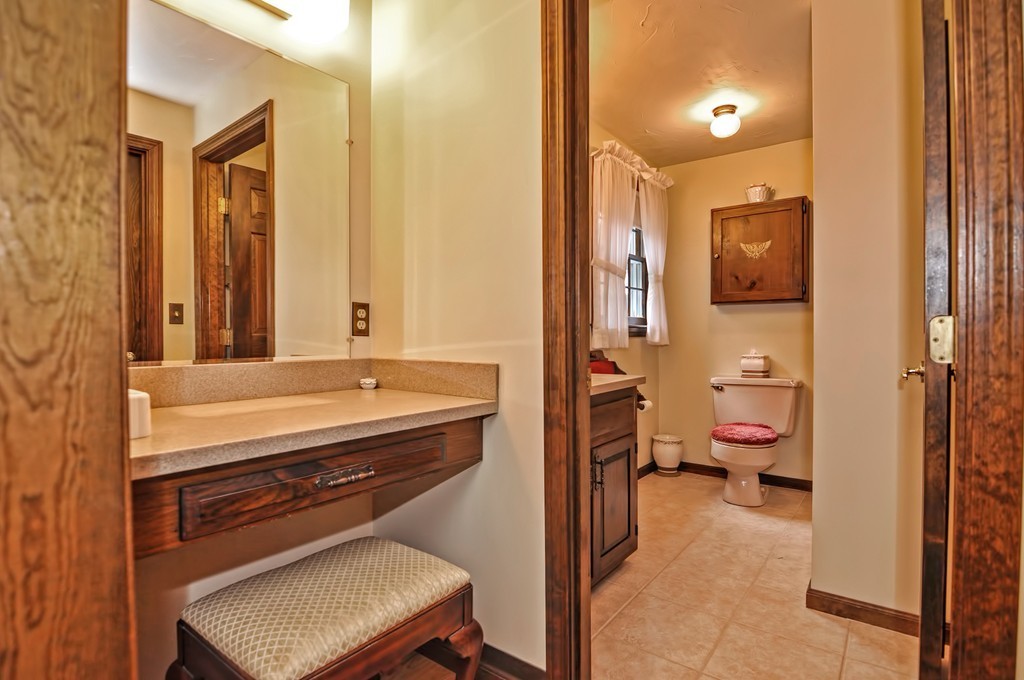 6 Joseph Road Mendon, MA 01756 - Photo 23 of 30 a en suite bathroom with a sink a toilet a mirror and shower