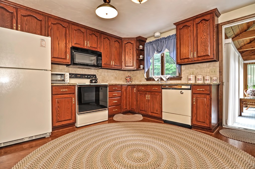 6 Joseph Road Mendon, MA 01756 - Photo 4 of 30 a kitchen with stainless steel appliances granite countertop a stove a sink dishwasher and a refrigerator