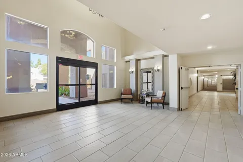 a living room with furniture and white walls