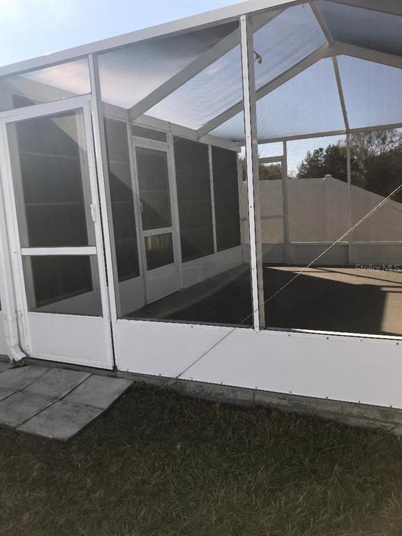 7019 Belt Link Loop Wesley Chapel, FL 33545 - Photo 13 of 14 a view of a room with door