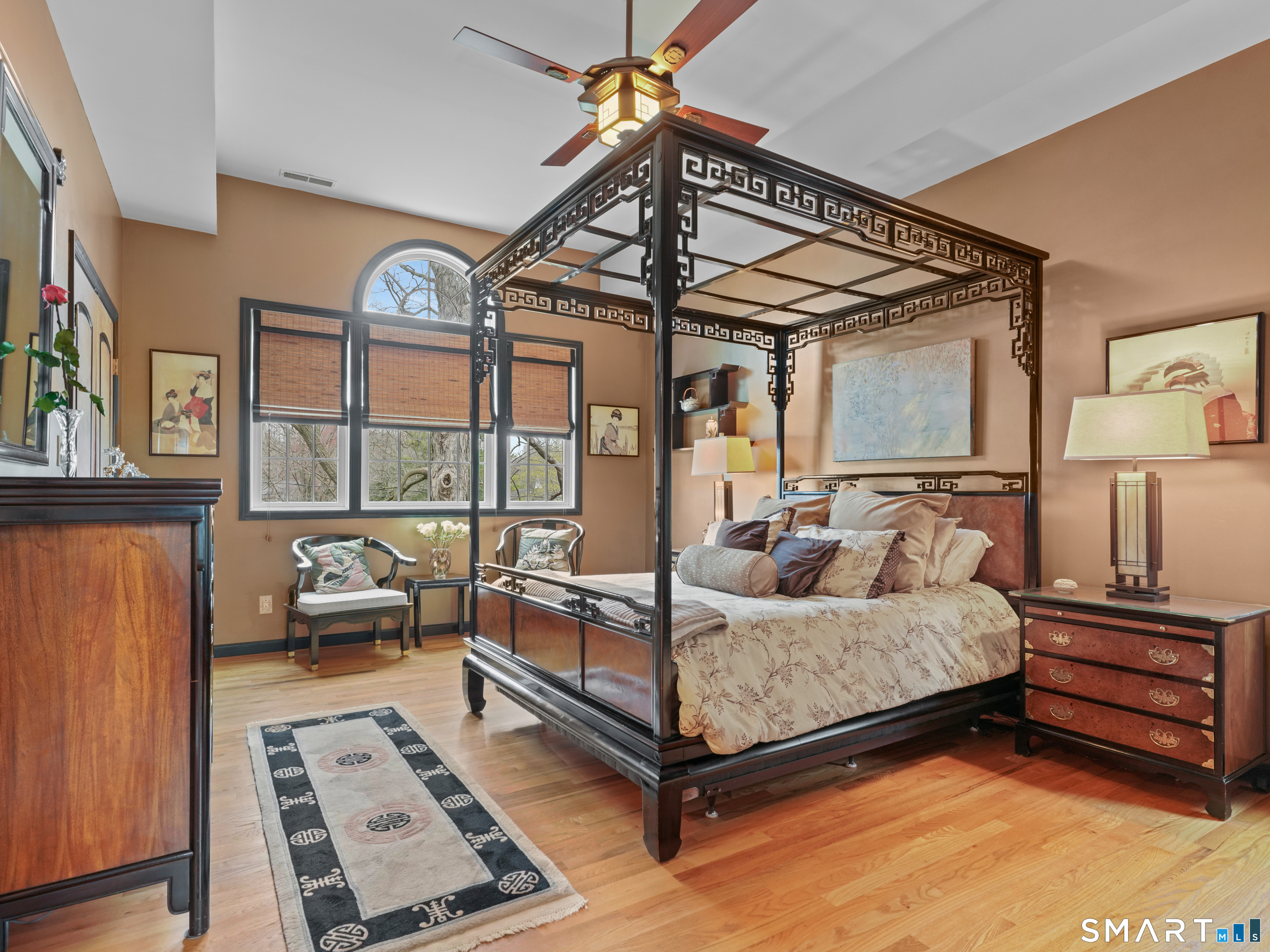 82 Ramapoo Road Ridgefield, CT 06877 - Photo 23 of 40 The primary bedroom features a soaring tray ceiling and lots of closet space.