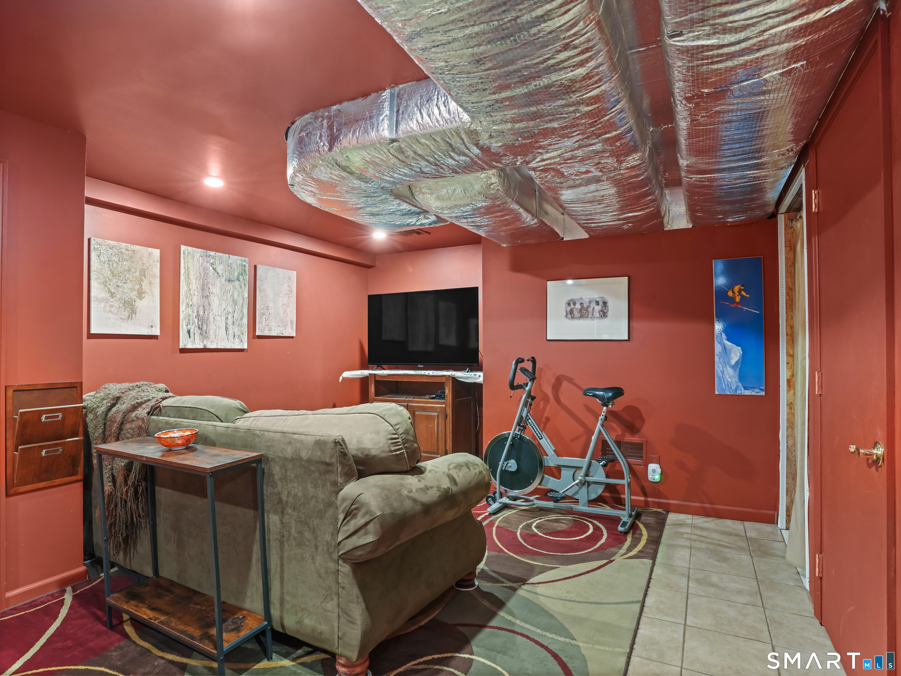 82 Ramapoo Road Ridgefield, CT 06877 - Photo 36 of 40 The lower level playroom offers extra finished living space as well as lots of storage on this level.