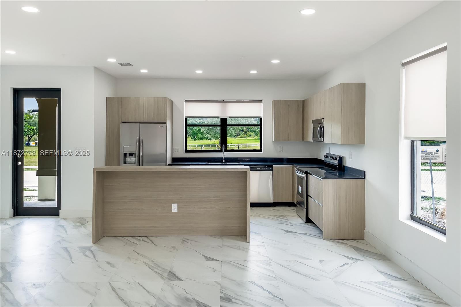 6159 Southwest 36th Court Miramar, FL 33023 - Photo 11 of 28 a living room with a couch and a window
