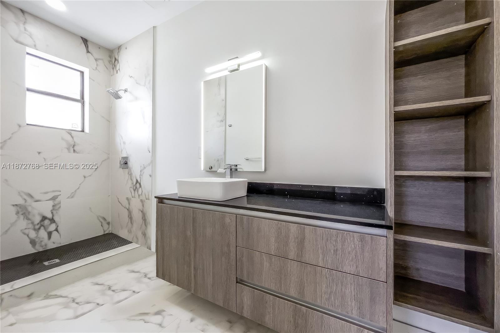 6159 Southwest 36th Court Miramar, FL 33023 - Photo 18 of 28 a bathroom with a sink and a mirror