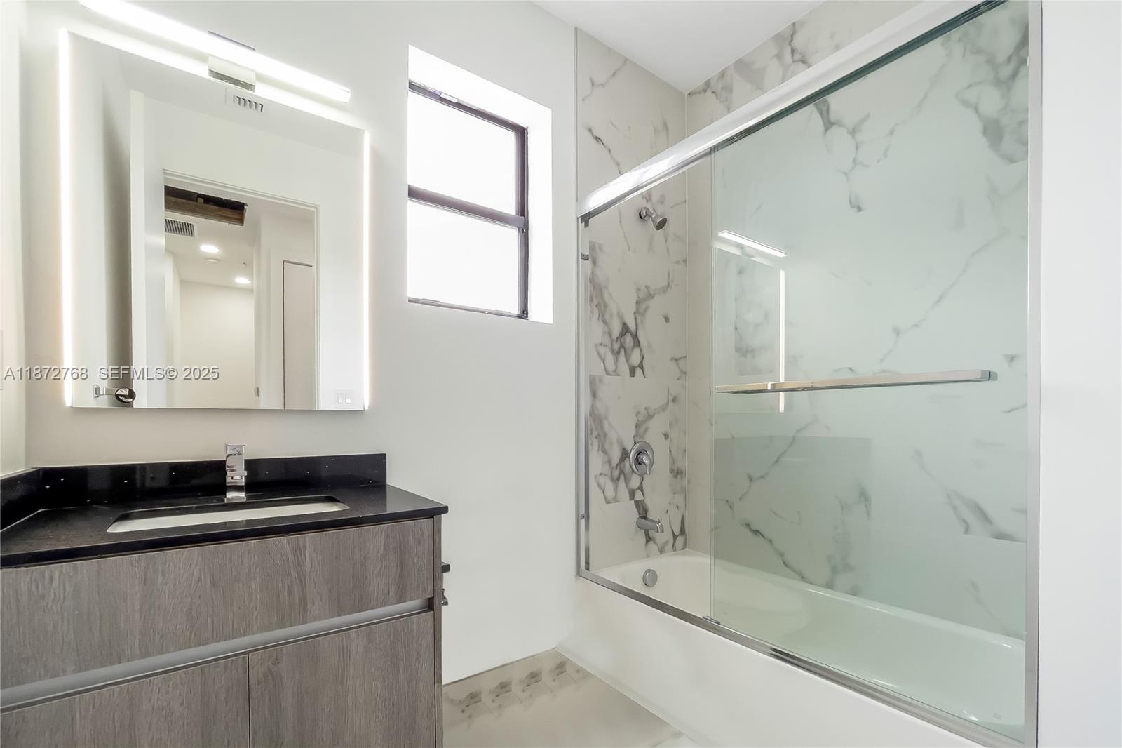 6159 Southwest 36th Court Miramar, FL 33023 - Photo 23 of 28 a bathroom with a bathtub and a shower